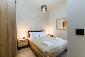 Superior appartement, 1 slaapkamer | 1 slaapkamer, een kluis op de kamer, een strijkplank/strijkijzer
