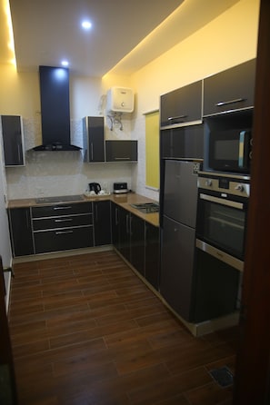 Fridge, microwave, oven, stovetop - Gulberg Suites (Lahore)