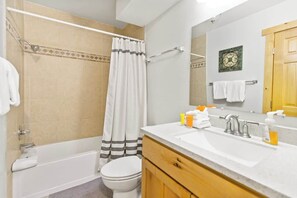 Shower, hair dryer, towels, shampoo