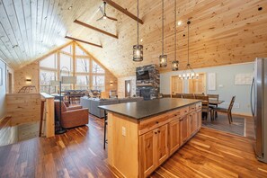 A spacious kitchen with a large island, wooden ceiling, and built-in appliances. - Escape to Mountains w/ All Suites & Mountain Views (McHenry)