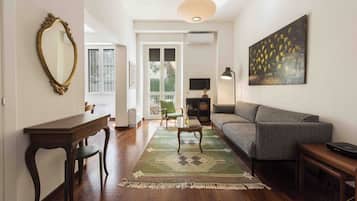 Comfort Apartment | Living area | 40-inch flat-screen TV with digital channels