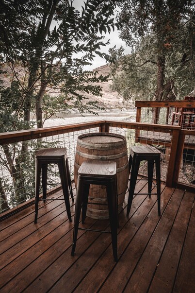 Mid-century modern cowboy retreat with a 35-ft. deck on the Salmon River.