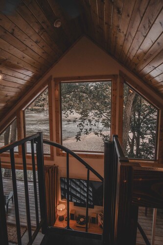 Mid-century modern cowboy retreat with a 35-ft. deck on the Salmon River.