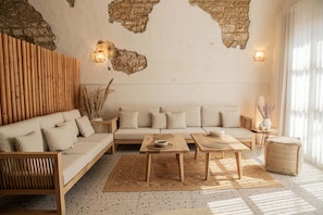 Grand Double Room | Living area | 50-inch Smart TV with satellite channels - Yam Suites (Enfeh)