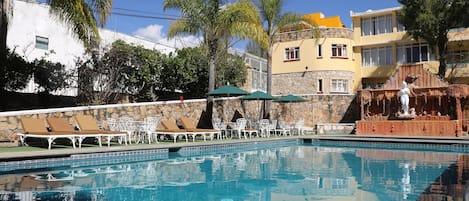 Outdoor pool, open 8:00 AM to 8:00 PM, pool umbrellas, pool loungers