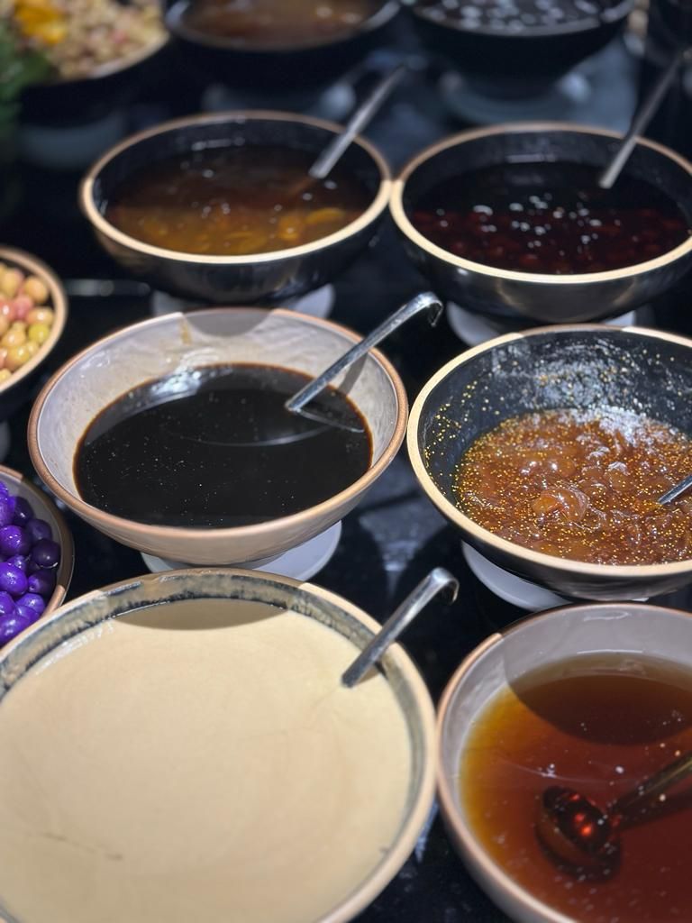 A variety of bowls with different contents, possibly for a meal or snack.