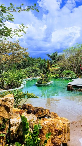 Beautiful tropical farm with spectacular pool located on a river.