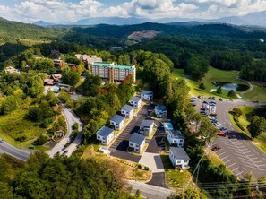 Surrounded by lush greenery and rolling hills, this residential area offers a tranquil setting with easy parking access.