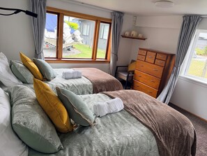 Beautiful sunny room with 
twin beds.
