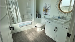 A bathroom with a shower, toilet, and sink. - Brooklynn Suite - Pet Friendly - Dukes Place (Brandon)