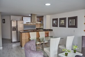 Comfort Apartment | Private kitchen | Full-sized fridge, oven, stovetop, blender