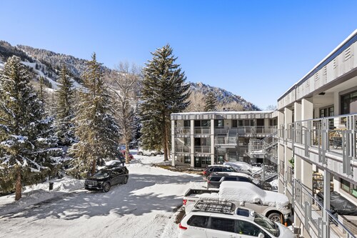 Silverglo Condominiums Unit 202 | Upgraded Condo with Wood-Burning Fireplace and Access to a Pool