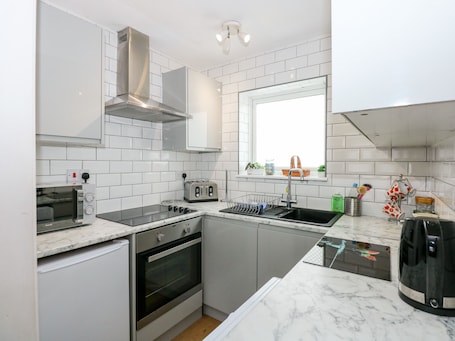 Fridge, electric kettle, toaster, cookware/dishes/utensils