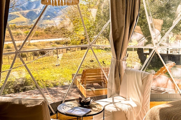 Design Tent | Living area | 42-inch Smart TV with satellite channels, Netflix, streaming services