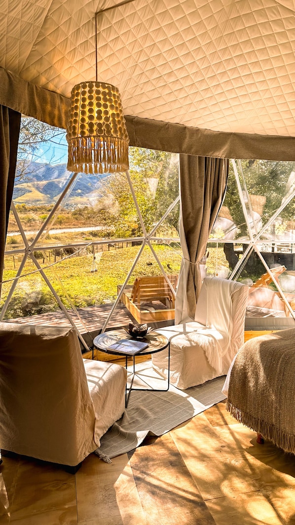 Design Tent | Living area | 42-inch Smart TV with satellite channels, Netflix, streaming services