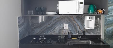 Full-size fridge, blender, cookware/dishes/utensils
