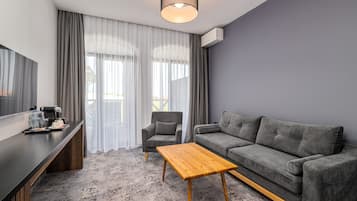 Family Suite | Living area | Flat-screen TV, foosball, table tennis