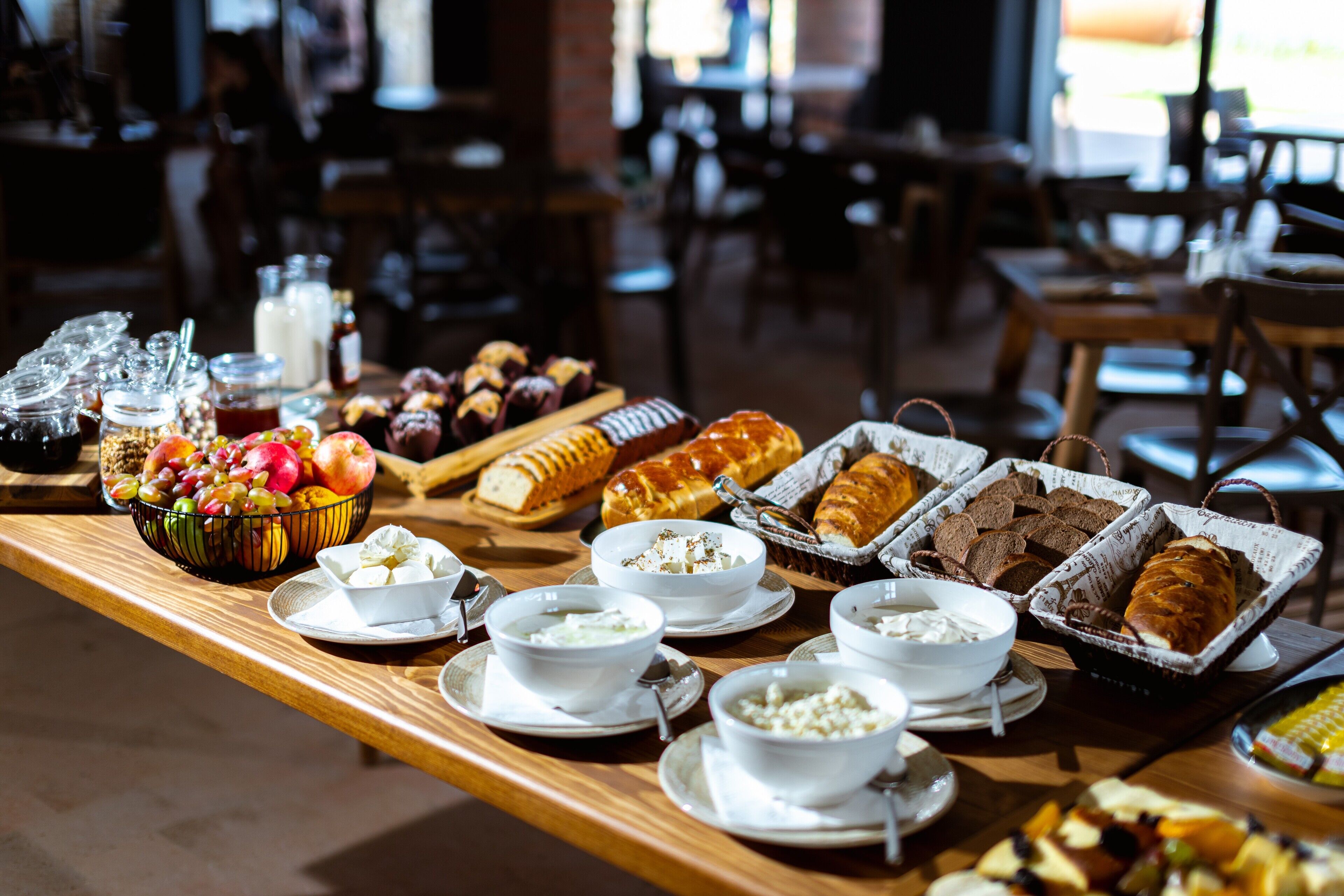 A breakfast buffet with various food items and beverages.