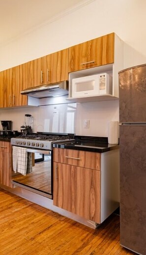Fridge, microwave, stovetop, coffee/tea maker
