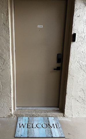 Digital doorlock, Blink security camera, and heavy duty welcome mat
