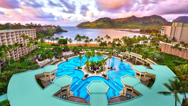 A resort with a large central pool, multiple smaller pools, and a beach view. - Marriott Kauai Lagoons - Kalanipu'u - Luxurious 2-Bedoom - Beachfront resort - Family Friendly (Lihue)
