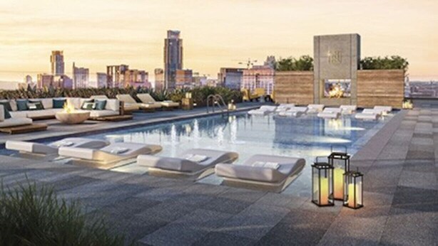 A rooftop pool area with lounge chairs and a fire feature. - Luxury 1BR +Views+Rooftop Pool +Walk To Rainey St. (Austin)
