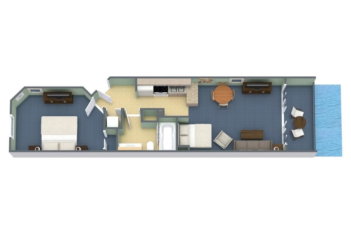 A floor plan of a hotel room with a bed, a desk, a chair, a small table, a sofa, a TV, and a window overlooking the sea.