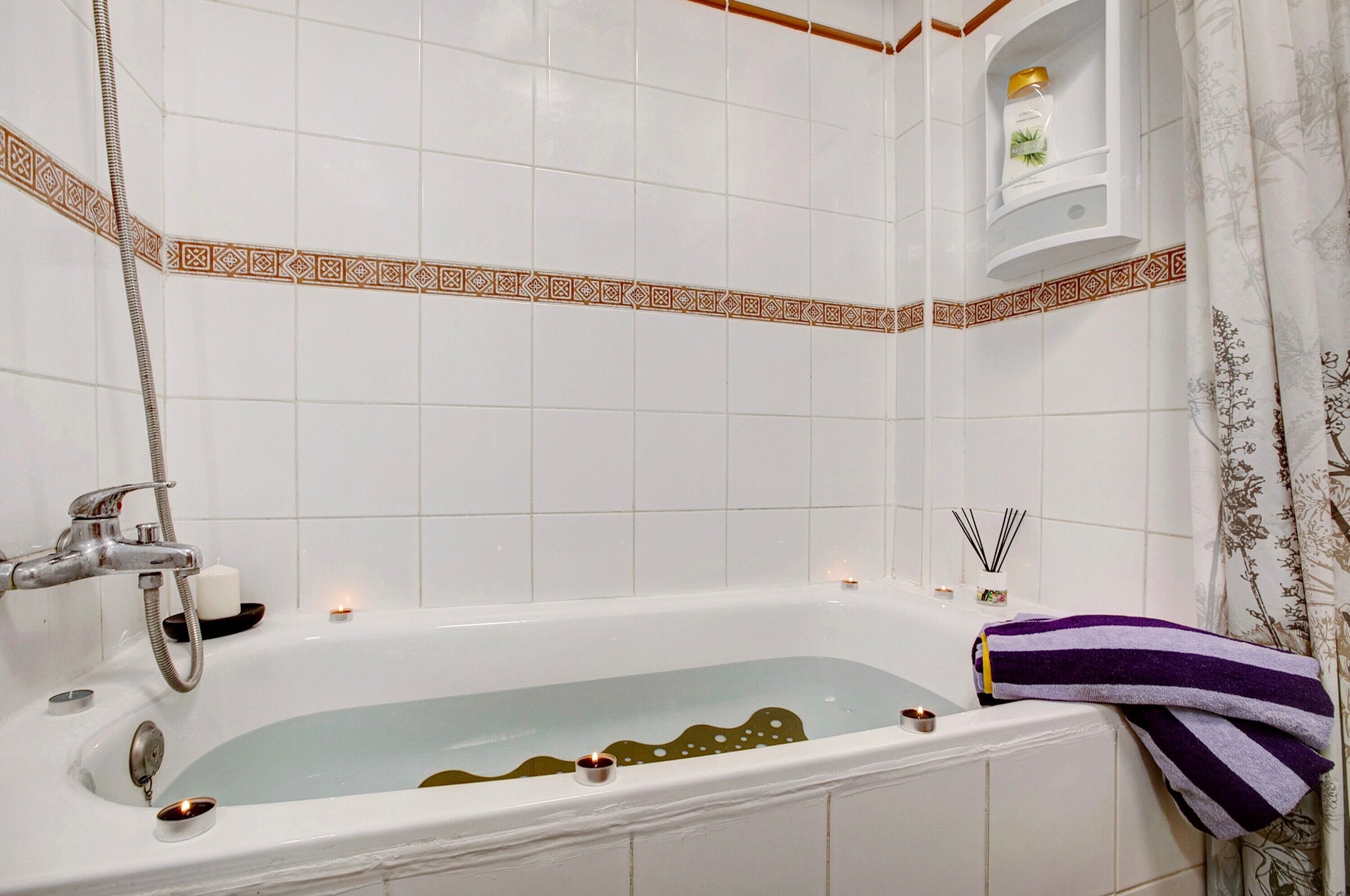 Bathtub, hair dryer, towels