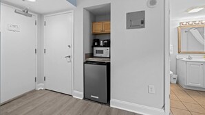 A compact kitchen with a microwave, coffee maker, and dishwasher. - Partial Oceanview Room  2 Queen Beds 9th Floor (Myrtle Beach)