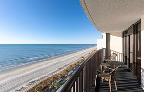 A balcony with a view of the beach and ocean. - Oceanfront 12th Floor 3BR Condo a Seaside Haven (Myrtle Beach)