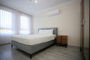 スタンダード アパートメント 1 ベッドルーム | 高級寝具、セレクト コンフォート製ベッド、客室ごとに異なる装飾、客室ごとに異なるインテリア