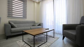 Family Apartment, 2 Bedrooms | Living area | 43-inch LED TV with satellite channels