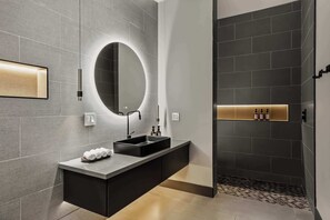 Shower, hair dryer, towels, shampoo