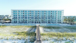 A modern hotel with multiple floors, a swimming pool, and a beach area. - Blu 501 ~ Luxury End-Unit w/3 Master Suites & Amazing Oceanfront Views ~ Sleeps 8 (Fort Walton Beach)