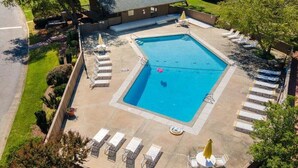 An aerial view of a swimming pool with lounge chairs and a covered area. - Only two miles to UNC campus (Chapel Hill)