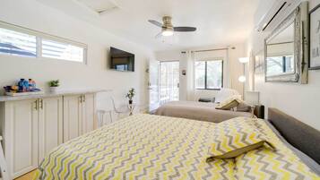 Laptop workspace, bed sheets