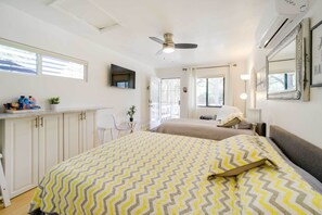 Laptop workspace, bed sheets