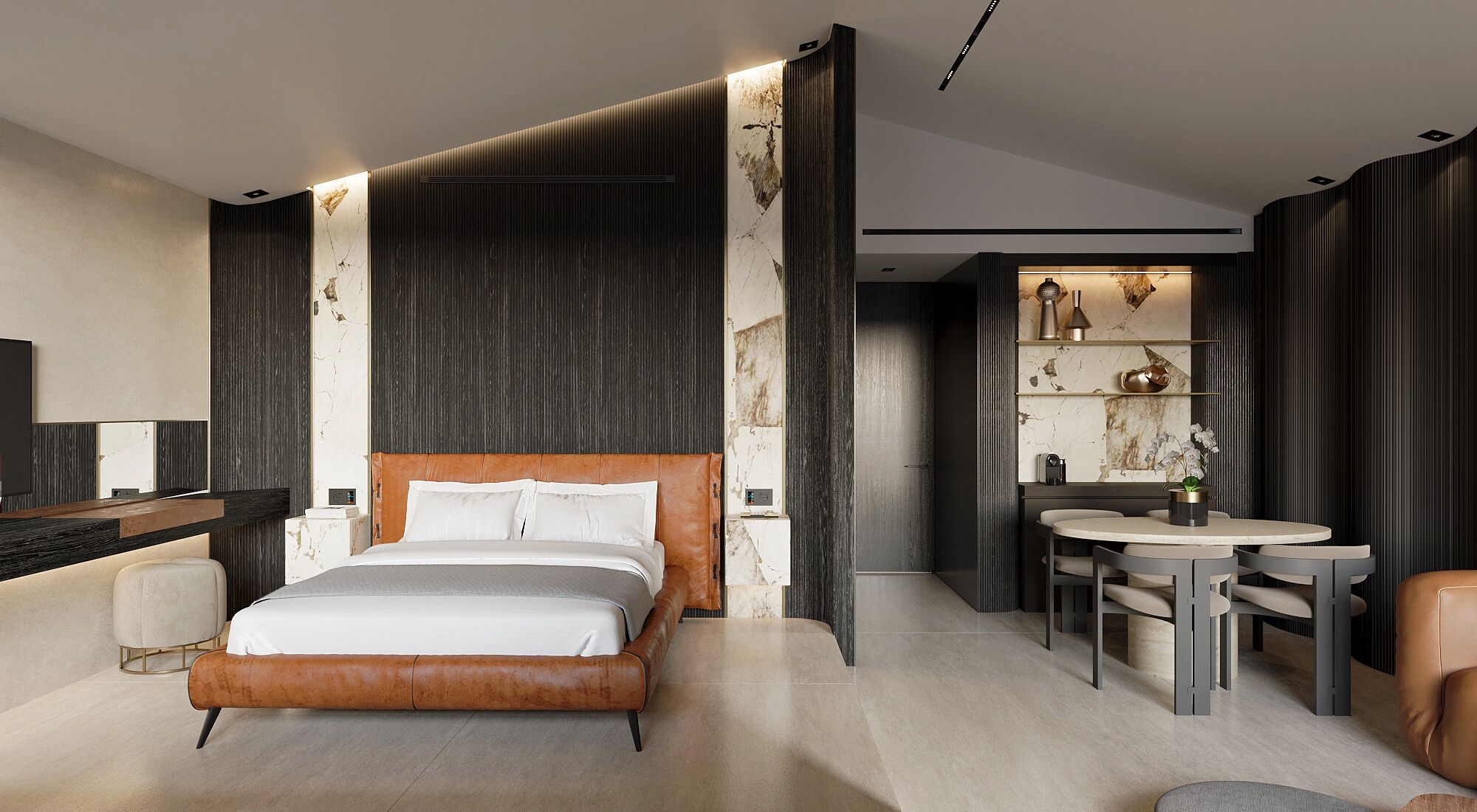 A modern hotel room with a large bed, a desk, and a seating area.