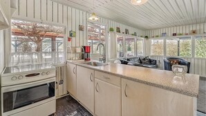 A kitchen with a large island, a double oven, and a sink. - Nice home in Sydals with WiFi (Sydals)