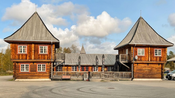 A large wooden building with two prominent towers, a covered walkway, and a central building with a peaked roof. - 1 bedroom cozy home in Grue Finnskog (Grue Finnskog)