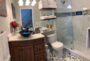 Shower, hair dryer, towels, soap
