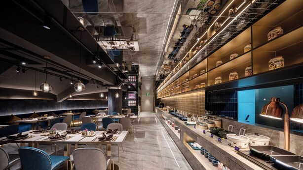 A modern restaurant interior with a long counter, seating area, and decorative lighting. - Manxin Hotel Hefei Jingkai District Pearl Plaza (Hefei)