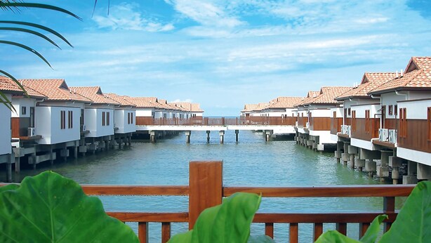 Overwater bungalows with a wooden deck and a view of the water. - Alpine GLX Port Dickson (Port Dickson)