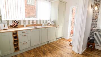 Fridge, electric kettle, toaster, cookware/dishes/utensils