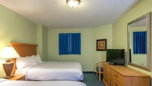 A hotel room with two beds, a television on a wooden dresser, a lamp, and a large mirror. - Amazing Views from 19th Floor! Sleeps 8 (Myrtle Beach)
