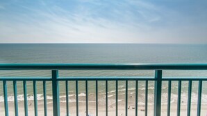 A beach view with a clear sky, a railing, and the ocean. - Amazing Views from 19th Floor! Sleeps 8 (Myrtle Beach)