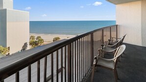 A balcony with a view of the beach and ocean. - Ocean View Retreat 3 Bedroom Condo with a Balcony (Myrtle Beach)