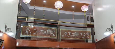 A staircase with wooden railings and decorative wall panels.