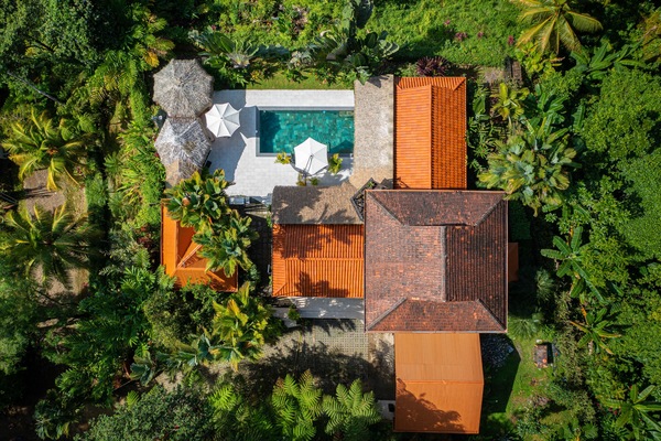 An aerial view capturing the expansive grounds, layout of home & design