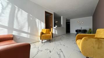 Comfort Apartment | Living area | Flat-screen TV